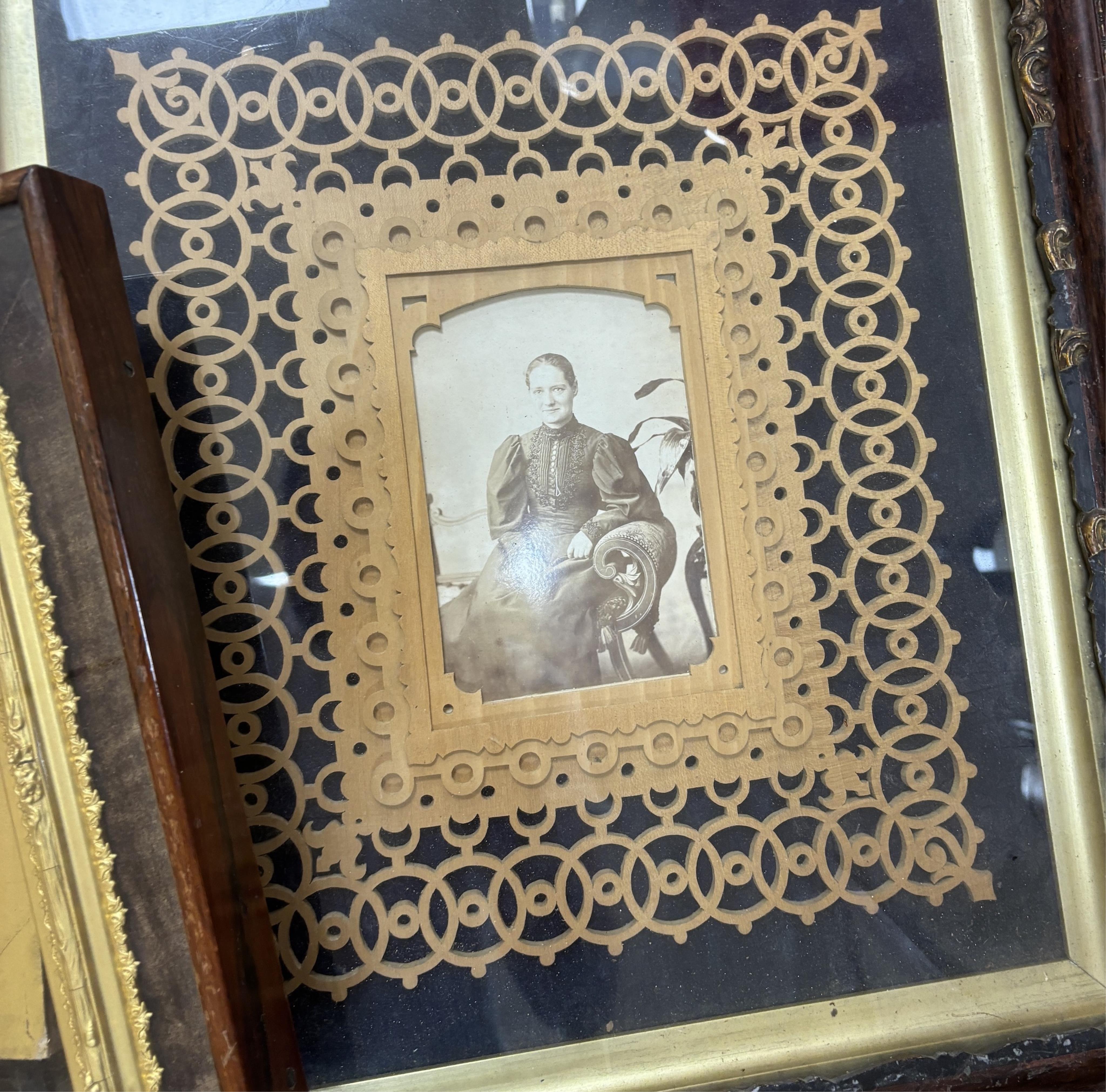 Three framed photos and a mirror